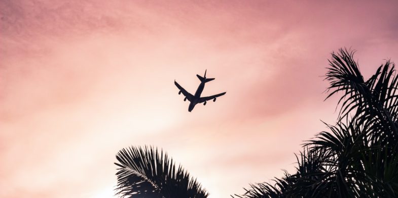 airplane under cloudy sky during daytime